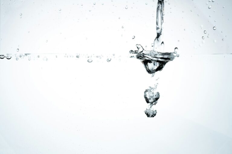Jet of water forms small water vortex with funnel shape