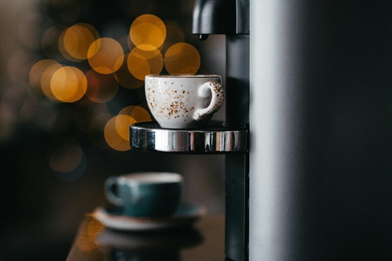 Preparing espresso with a coffee machine. Brewing coffee at home.